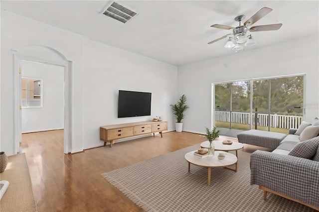 living room with ceiling fan and hardwood / wood-style floors