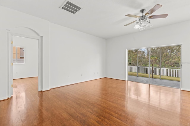 spare room featuring ceiling fan and light hardwood / wood-style flooring