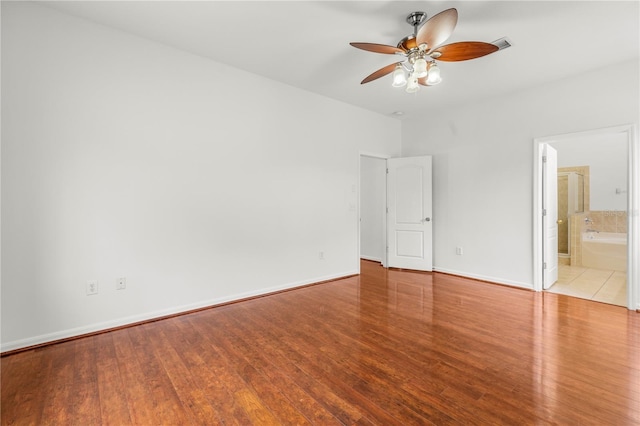 unfurnished bedroom featuring ceiling fan, light hardwood / wood-style floors, and ensuite bath