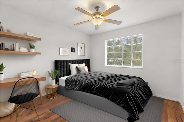 bedroom featuring ceiling fan and hardwood / wood-style flooring