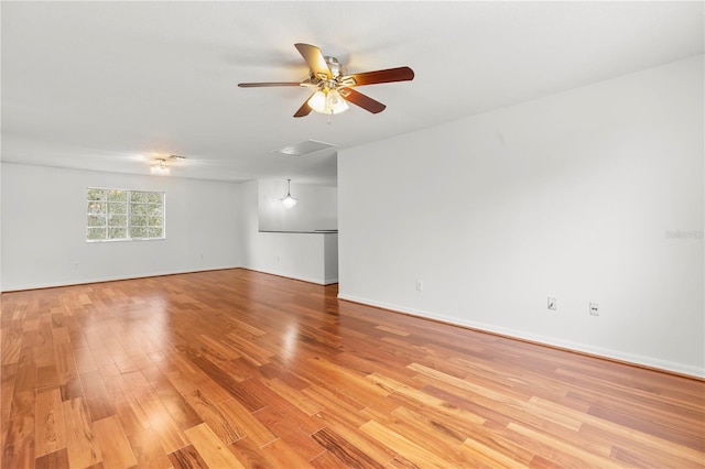 spare room with ceiling fan and light hardwood / wood-style flooring