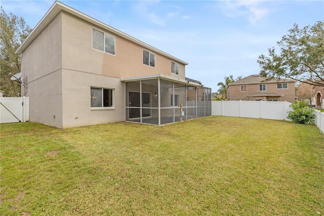 rear view of property with a yard