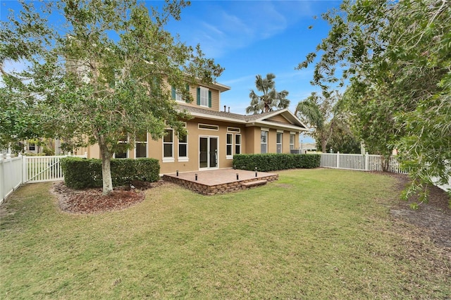 back of house with a lawn and a patio area