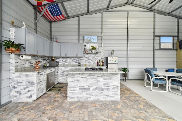 view of patio featuring area for grilling and a wet bar