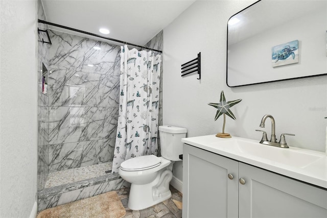 bathroom featuring vanity, toilet, and a shower with shower curtain