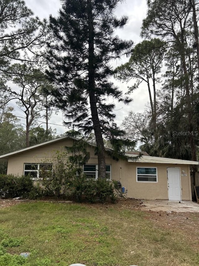 rear view of house with a lawn