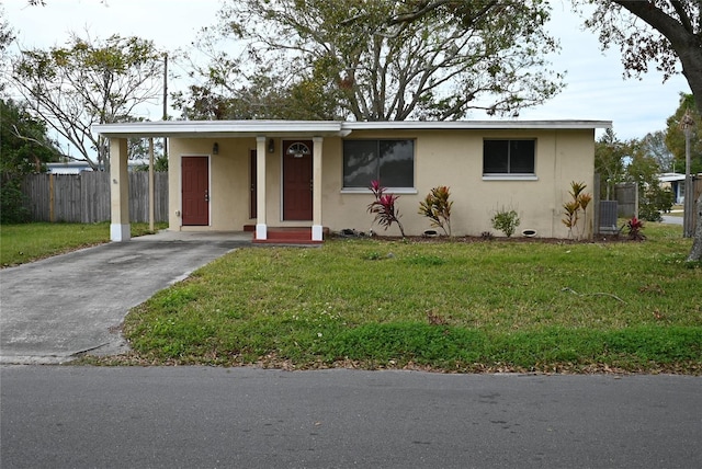 single story home featuring cooling unit and a front lawn