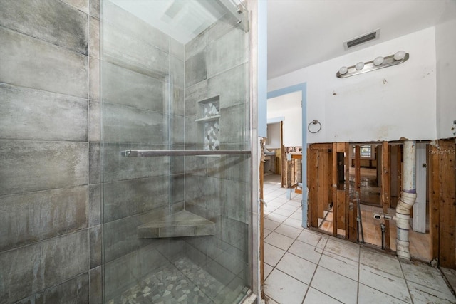 bathroom featuring tile patterned flooring and walk in shower