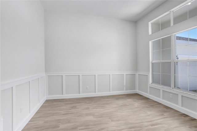 unfurnished room featuring light hardwood / wood-style floors