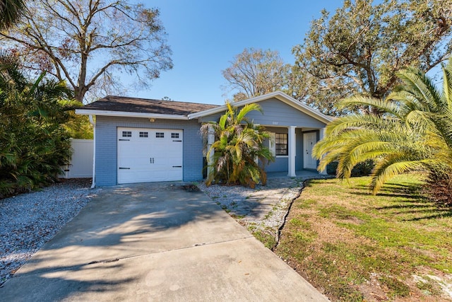 ranch-style home with a garage and a front yard