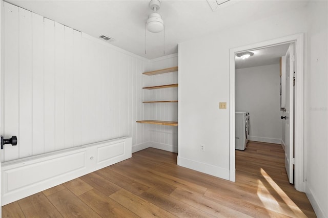 interior space featuring separate washer and dryer and light wood-type flooring