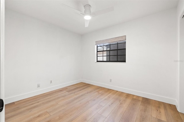 empty room featuring ceiling fan and light hardwood / wood-style flooring