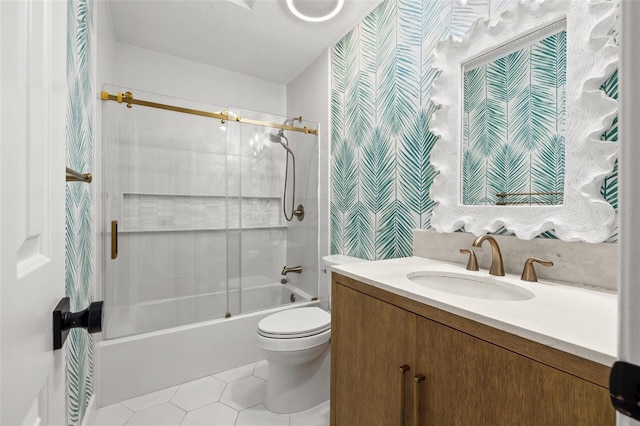 full bathroom with vanity, tile patterned flooring, toilet, and combined bath / shower with glass door