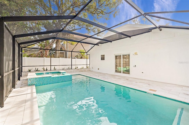 view of pool with a patio and glass enclosure