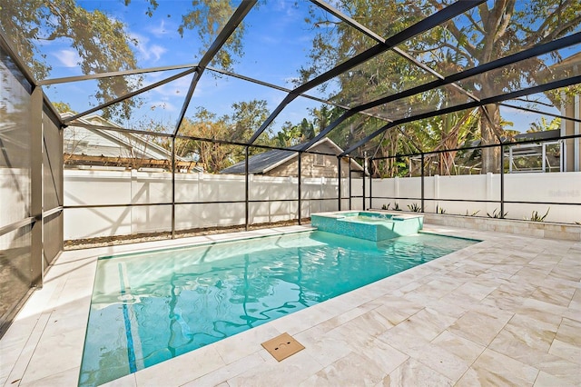 view of pool with a patio, an in ground hot tub, and glass enclosure