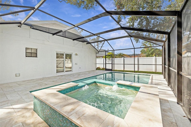 view of swimming pool with an in ground hot tub, a patio area, and glass enclosure