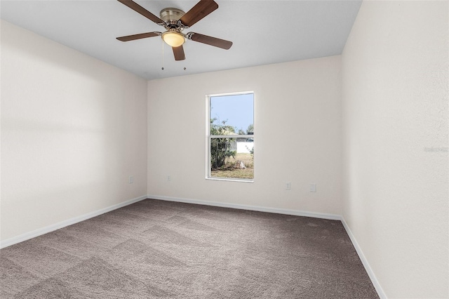 spare room with carpet flooring and ceiling fan