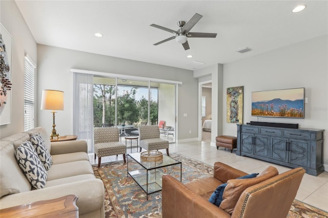 living room featuring light tile patterned flooring and ceiling fan