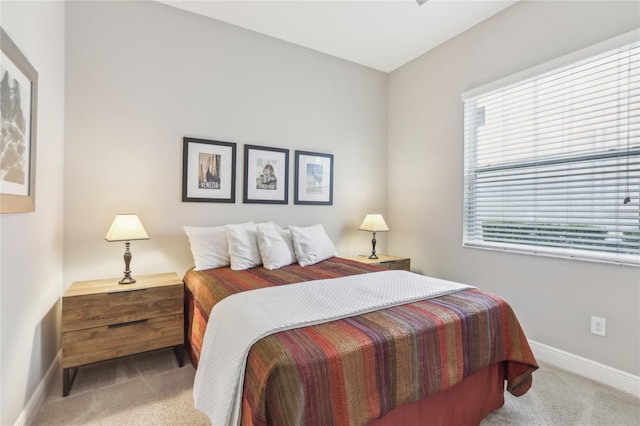 bedroom featuring light carpet