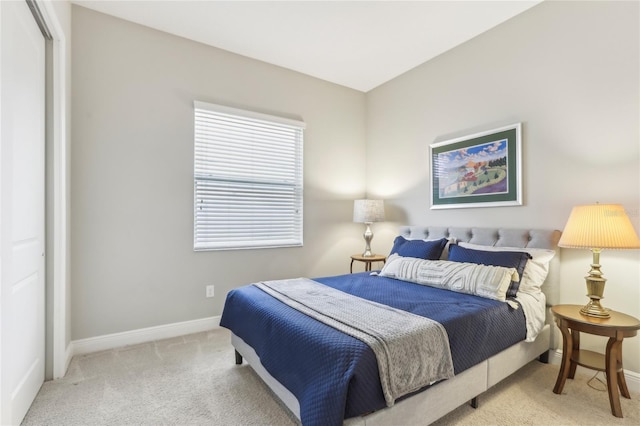 carpeted bedroom with a closet