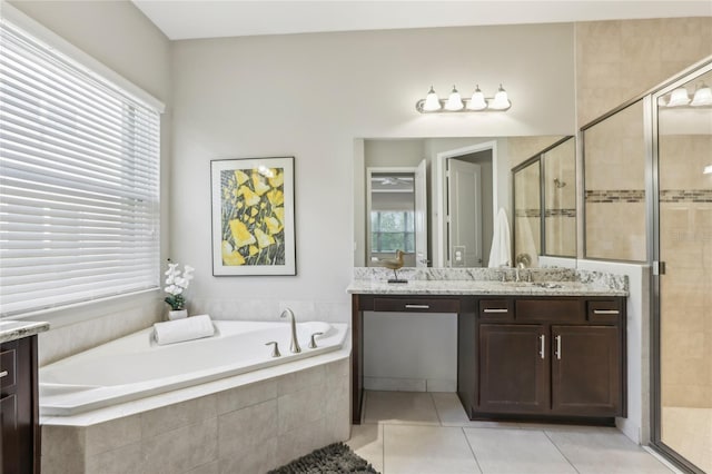 bathroom featuring tile patterned floors, vanity, and separate shower and tub