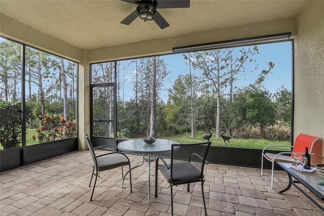 sunroom / solarium with ceiling fan