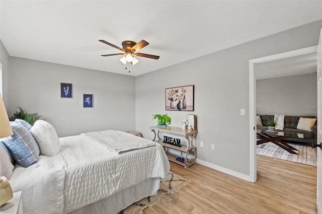 bedroom featuring ceiling fan and light hardwood / wood-style flooring