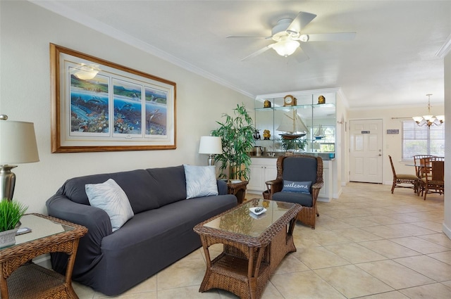 tiled living room featuring ceiling fan with notable chandelier and crown molding