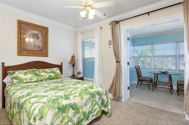 bedroom featuring ceiling fan, light carpet, and crown molding