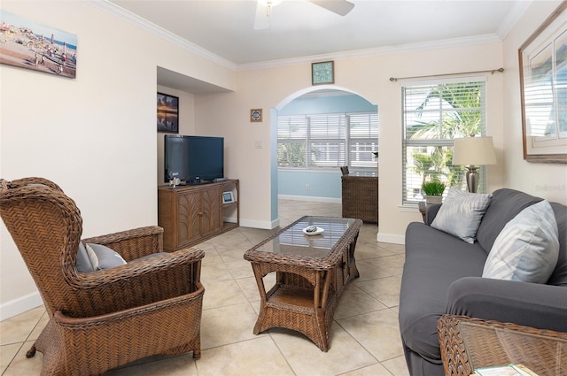 tiled living room featuring ceiling fan and ornamental molding