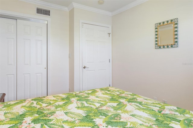 unfurnished bedroom with a closet and ornamental molding