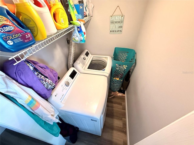 laundry area featuring dark wood-type flooring and independent washer and dryer