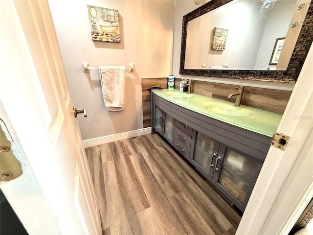 bathroom featuring hardwood / wood-style flooring and vanity