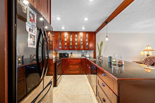 kitchen with kitchen peninsula, black appliances, a textured ceiling, pendant lighting, and sink