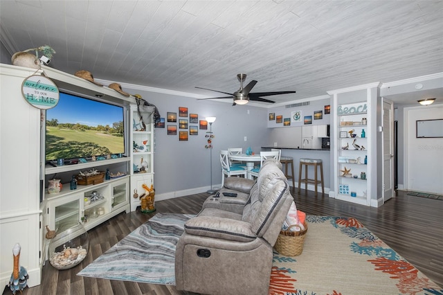 living room with crown molding, dark wood-type flooring, and ceiling fan