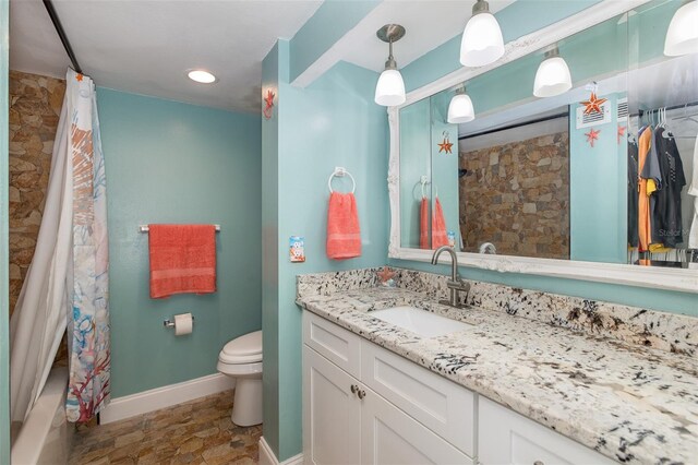 full bathroom featuring vanity, toilet, and shower / tub combo