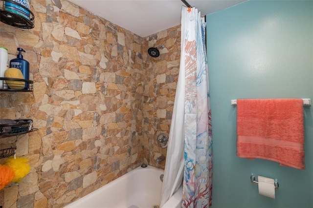 bathroom with shower / tub combo with curtain