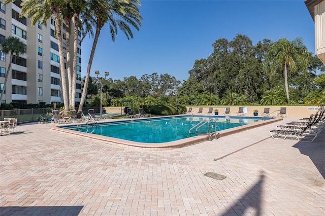 view of swimming pool featuring a patio