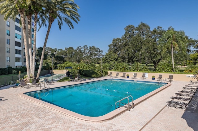 view of swimming pool featuring a patio area