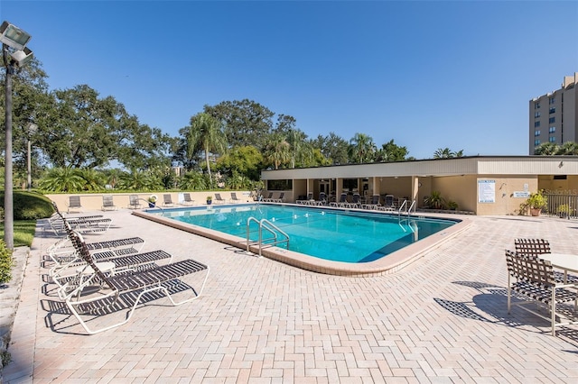 view of swimming pool with a patio area