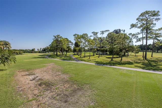 view of property's community featuring a yard