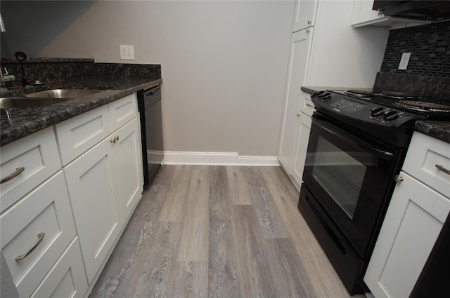 kitchen with white cabinetry, dark stone countertops, tasteful backsplash, and black appliances