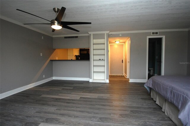 unfurnished bedroom with ornamental molding, dark hardwood / wood-style floors, and ceiling fan