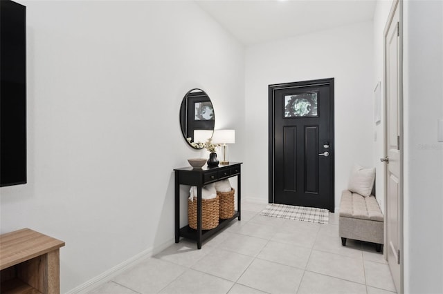 foyer entrance with light tile patterned floors