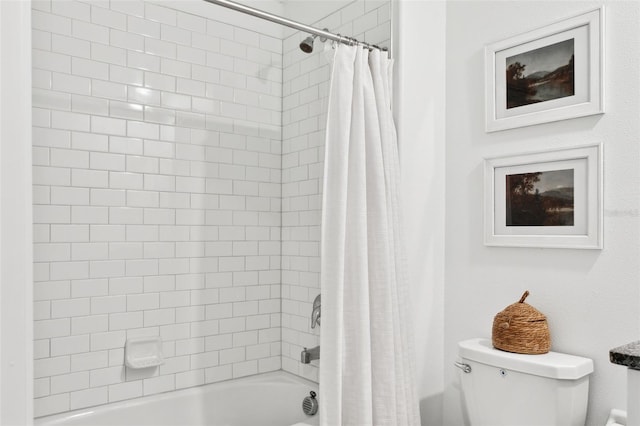 bathroom featuring toilet and shower / bath combo