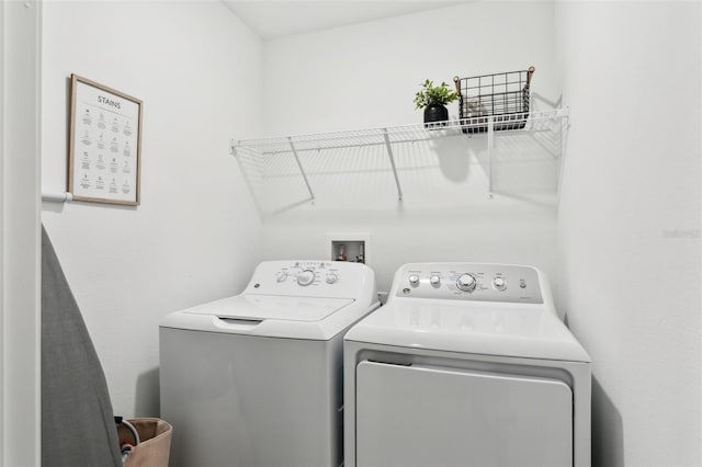 washroom featuring washing machine and dryer