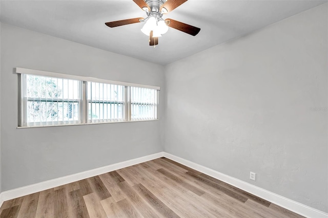 empty room with light hardwood / wood-style flooring and ceiling fan