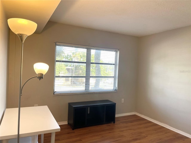 office area featuring dark wood-type flooring