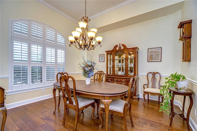 dining area with a notable chandelier, crown molding, and dark hardwood / wood-style floors