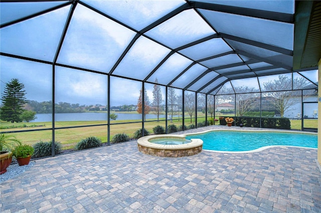 view of swimming pool featuring a water view, an in ground hot tub, a lanai, and a patio area